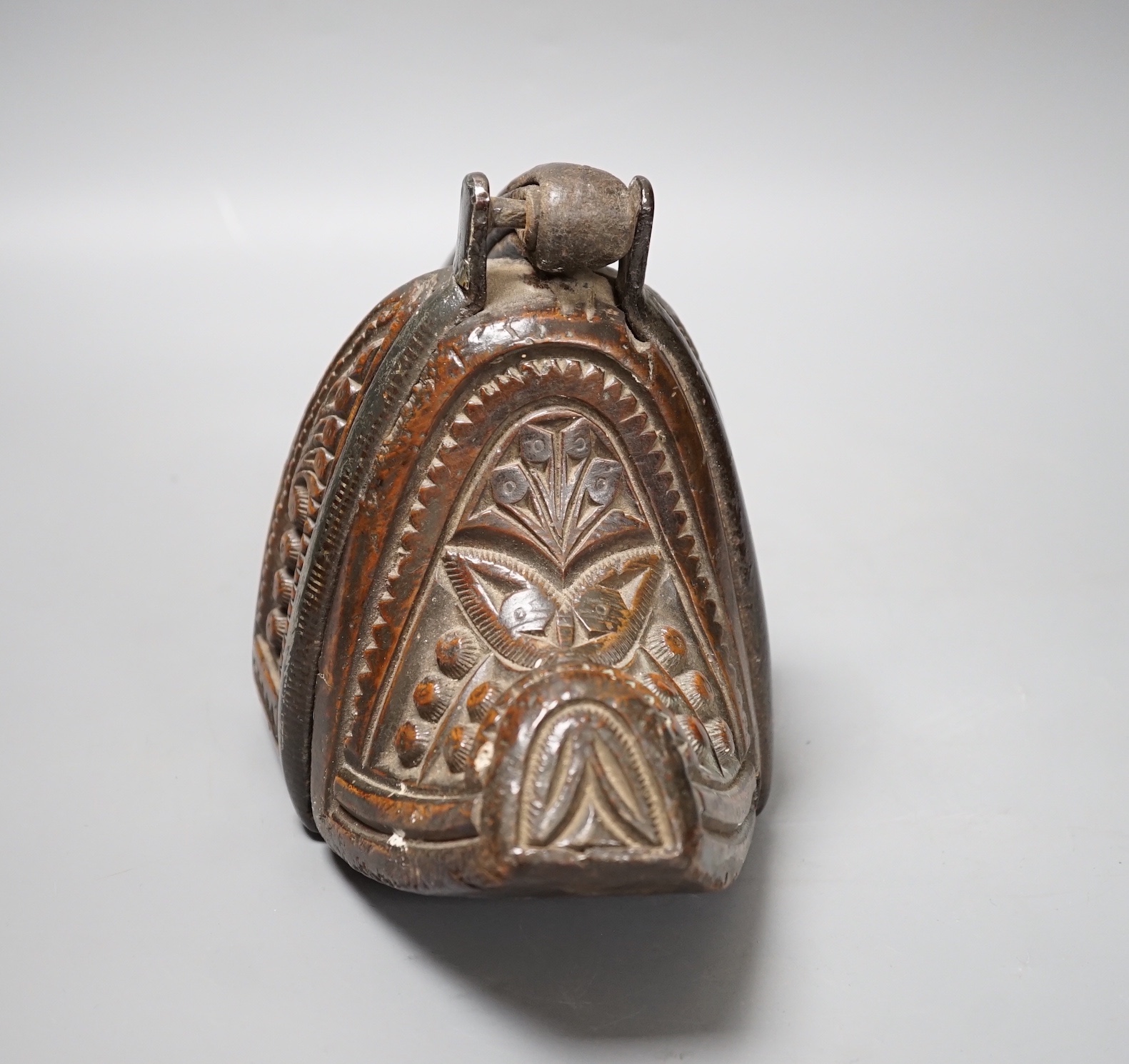 A 19th century Mongolian carved wood and bronze stirrup shoe